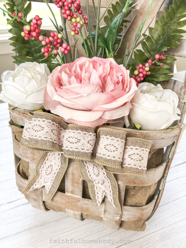 How to Make a Hanging Tobacco Basket for Valentine's Day.  A burlap and pink lace bow is attached to the front of the tobacco basket.